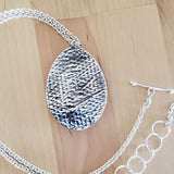 Back view of larimar and sterling silver pendant necklace from Capulin Creations