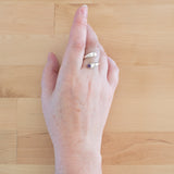 Hand of woman wearing the Amethyst and Sterling Silver Adjustable Ring with One Stone