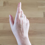 Hand of Woman Wearing Aquamarine and Sterling Silver Adjustable Ring with One Stone