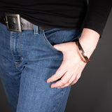 Woman Wearing the Bangle Bracelet in Copper from the Bubbles Collection