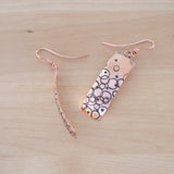 Front and Side View of the Dangle Earrings in Copper from the Bubbles Collection