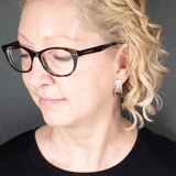 Woman Wearing the Post Earrings in Copper from the Bubbles Collection