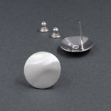 Front and back view of sterling silver button earrings in a satin finish from Capulin Creations