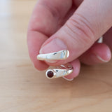 Hand of woman holding the Carnelian and Sterling Silver Adjustable Ring with One Stone