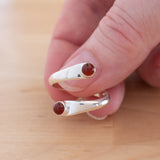 Hand of woman holding the Carnelian and Sterling Silver Adjustable Ring with Two Stones