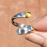 Hand of woman holding the Citrine and Sterling Silver Adjustable Ring with One Stone