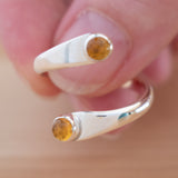 Hand of woman holding the Citrine and Sterling Silver Adjustable Ring with Two Stones