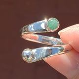 Hand Holding the Emerald and Sterling Silver Adjustable Ring with One Stone and One Granule