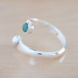 Side View of the Emerald and Sterling Silver Adjustable Ring with One Stone and One Granule