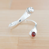 Side view of the Garnet and Sterling Silver Adjustable Ring with One Stone and One Granule