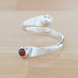 Side view of the Garnet and Sterling Silver Adjustable Ring with One Stone and One Granule
