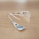 Back Views of Triangle-Shaped Dangle Earrings in Sterling Silver Stamped with Kokopelli