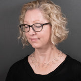 Woman Wearing Chain Necklace in Sterling Silver with Large and Tiny Round Links