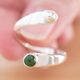 Hand of woman holding the Nephrite Jade and Sterling Silver Adjustable Ring with One Stone and One Granule