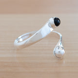 Side view of the Onyx and Sterling Silver Adjustable Ring with One Stone and One Granule