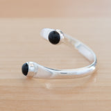 Side view of the Onyx and Sterling Silver Adjustable Ring with Two Stones