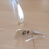Front and Back Views of Triangle-Shaped Dangle Earrings in Sterling Silver Stamped with Pinwheels