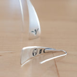 Front and Back Views of Triangle-Shaped Dangle Earrings in Sterling Silver Stamped with Sprouts