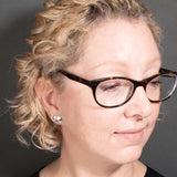 Woman wearing set of three sterling silver stud post earrings in sizes small, medium, and large - Capulin Creations