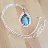 Front view of larimar and sterling silver pendant necklace, including the entire chain, from Capulin Creations