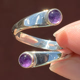 Hand of woman holding the Amethyst and Sterling Silver Adjustable Ring with Two Stones
