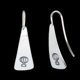 Front and side views of triangle-shaped sterling silver earrings stamped with hot air balloons from Capulin Creations