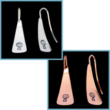 Front and side views of triangle-shaped sterling silver and copper earrings stamped with hot air balloons from Capulin Creations