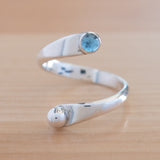 Front view of the Blue Topaz and Sterling Silver Adjustable Ring with One Stone and One Granule