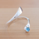 Side view of the Blue Topaz and Sterling Silver Adjustable Ring with One Stone