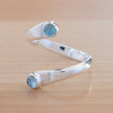 Side view of the Blue Topaz and Sterling Silver Adjustable Ring with Two Stones