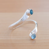 Side view of the Blue Topaz and Sterling Silver Adjustable Ring with Two Stones