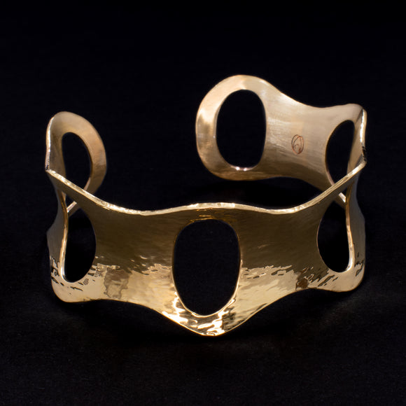 Front view of hammered brass cuff bracelet with ovals from Capulin Creations