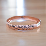 Front View of the Bangle Bracelet in Copper from the Bubbles Collection