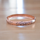 Front View of the Bangle Bracelet in Copper from the Bubbles Collection