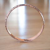 Side View of the Bangle Bracelet in Copper from the Bubbles Collection