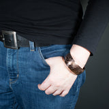 Woman Wearing the Cuff Bracelet in Copper from the Bubbles Collection