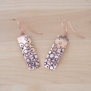 Front View of the Dangle Earrings in Copper from the Bubbles Collection