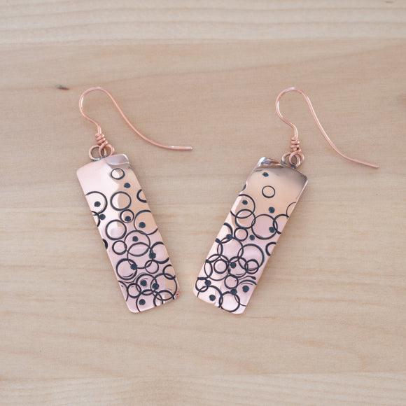 Front View of the Dangle Earrings in Copper from the Bubbles Collection