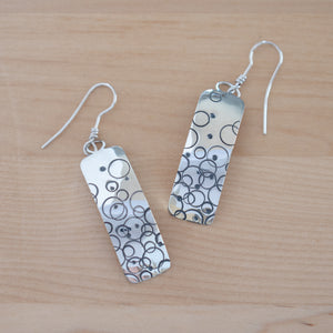Front View of the Dangle Earrings in Sterling Silver from the Bubbles Collection