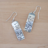 Front View of the Dangle Earrings in Sterling Silver from the Bubbles Collection