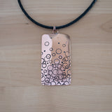 Front View of the Large Pendant Necklace in Copper from the Bubbles Collection