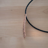 Side View of the Large Pendant Necklace in Copper from the Bubbles Collection