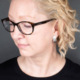 Woman Wearing the Post Earrings in Sterling Silver from the Bubbles Collection
