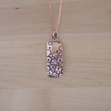 Front View of the Small Pendant Necklace in Copper from the Bubble Collection
