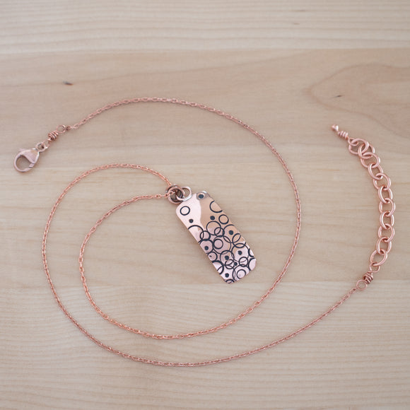 Full View of the Small Pendant Necklace in Copper from the Bubble Collection