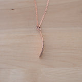Side View of the Small Pendant Necklace in Copper from the Bubble Collection