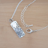 Detailed View of the Small Pendant Necklace in Sterling Silver from the Bubbles Collection