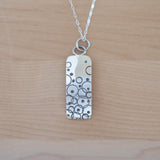 Front View of the Small Pendant Necklace in Sterling Silver from the Bubbles Collection