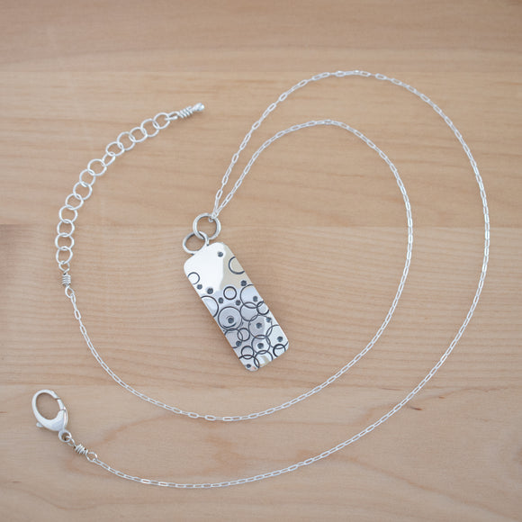 Full View of the Small Pendant Necklace in Sterling Silver from the Bubbles Collection