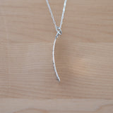 Side View of the Small Pendant Necklace in Sterling Silver from the Bubbles Collection